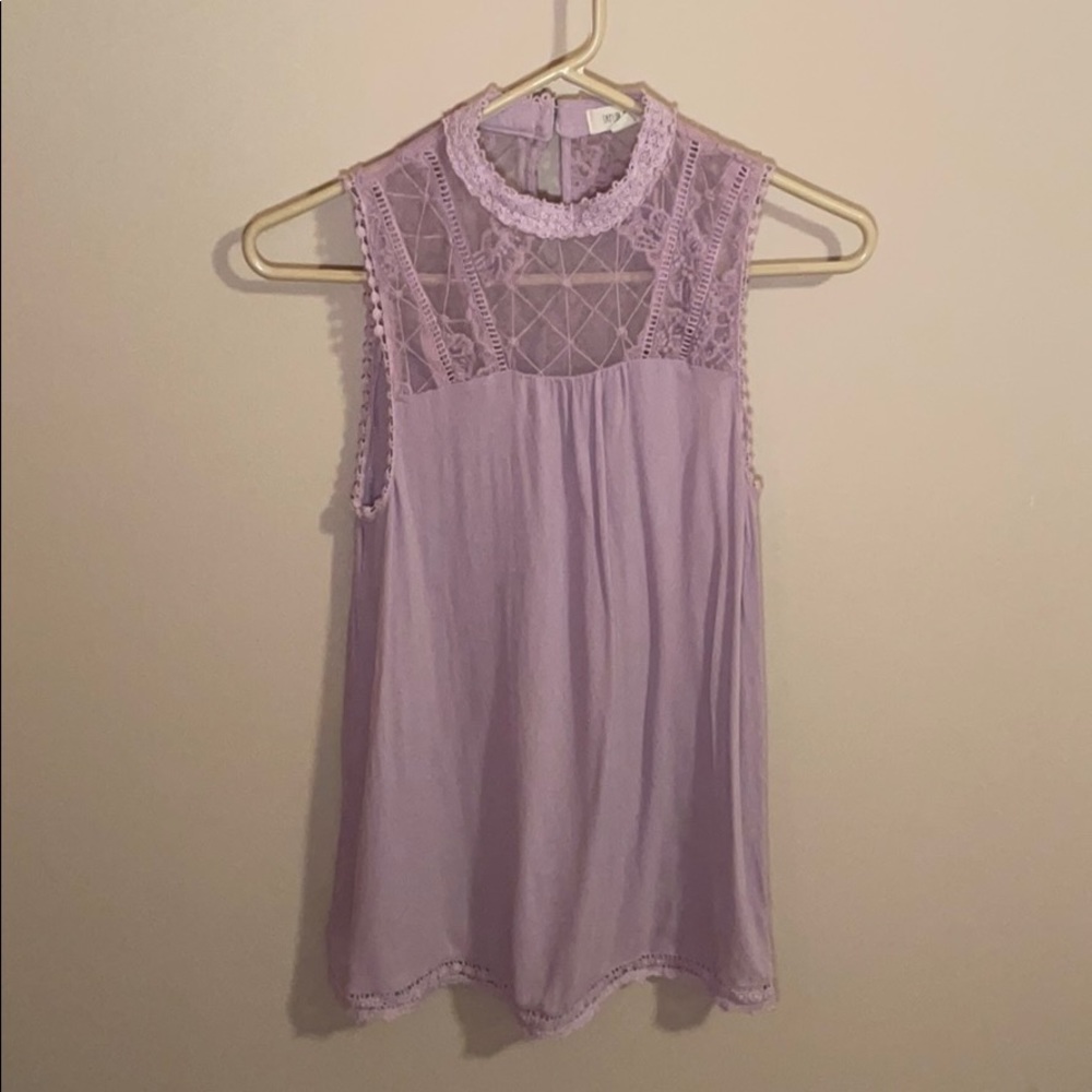 Lilac colored top with mock neck lace detail